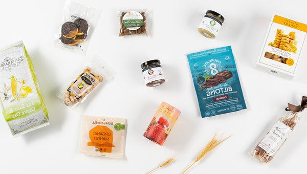 an array of California snacks including tapenade, sea salt caramels, California gummy bears, dried fruit and almonds.